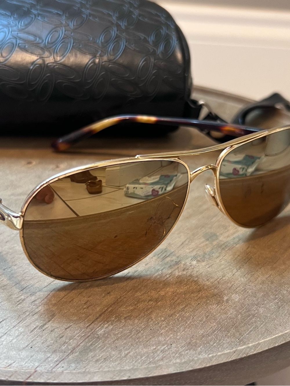 Oakley women’s tortoise with gold